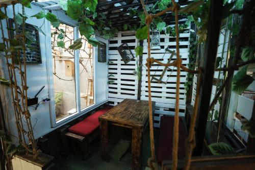 an outdoor room with a bench and a window at U ASHOTA in Yerevan