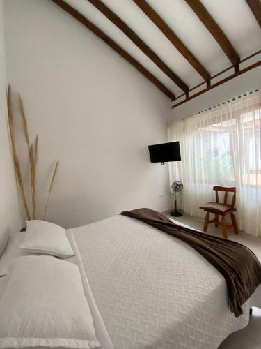 Postel nebo postele na pokoji v ubytování Hospedaje Villa Monica