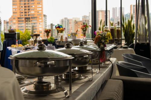 a row of pots and pans on a balcony at Haven A Design Hotel in Medellín