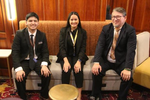 a group of three people sitting on a couch at The Mayfair Hotel Times Square, an Ascend Collection in New York
