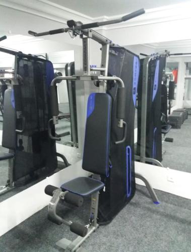 a gym with a row of exercise bikes at Résidence Les Deux Mules in Ahfir