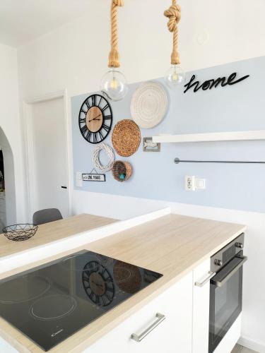 a kitchen with a counter top and a stove top oven at Angelina Greek House in Parikia