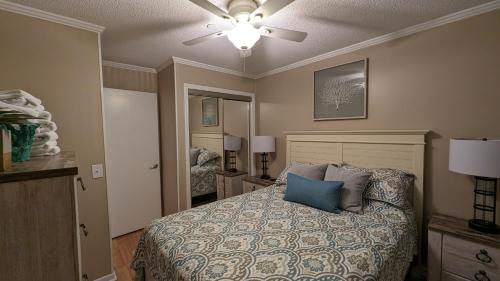 a bedroom with a bed and a ceiling fan at Ocean Dunes Villas in Hilton Head Island