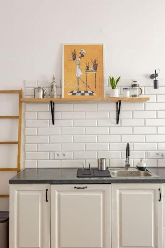 a kitchen with a counter top and a sink at Apartament ROZETA centrum 6os in Legnica