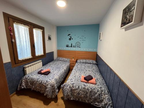 Ένα ή περισσότερα κρεβάτια σε δωμάτιο στο Las Mariposas de Villanúa