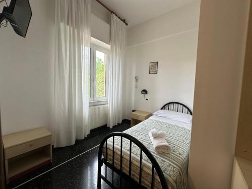 Katil atau katil-katil dalam bilik di Hotel La Pineta