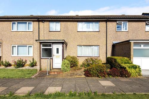 a brick apartment building with a white door at Private and Quiet Room in Harlow near Stansted Airport in Harlow