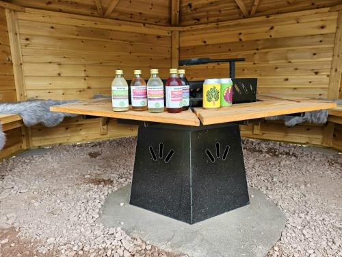 a wooden table with bottles on top of it at Villa Fregn in Ljørdal