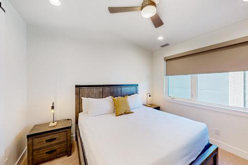 a bedroom with a large bed and a window at Yampa Valley Escape in Steamboat Springs
