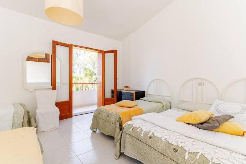 Ένα ή περισσότερα κρεβάτια σε δωμάτιο στο Villa Calipso