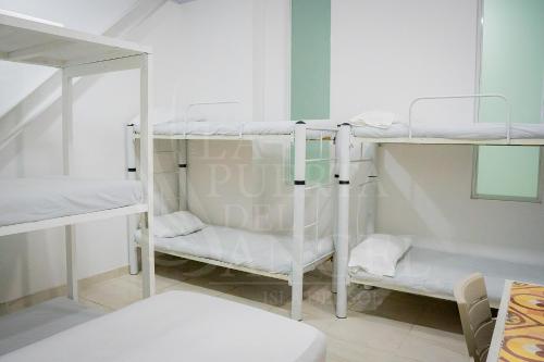 Postel nebo postele na pokoji v ubytování La Puerta del Ángel Isla