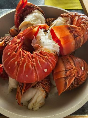 a plate of food with sushi on a table at Private Catamarán With Crew - DON C - Lagoon 40 feet - All Inclusive in Isla Wichitupo Grande