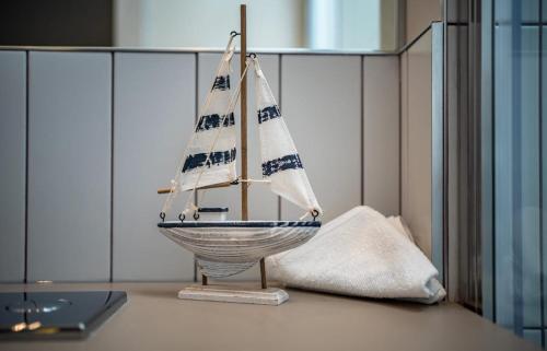 a toy boat on a table with a laptop at Number One Townhouse in Kinsale