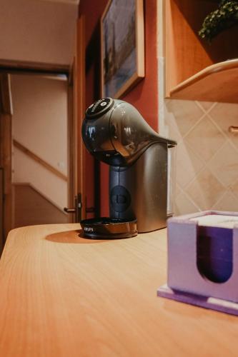 a coffee pot sitting on top of a table at 3-Bedroom Residence - Prime Location with City View and Parking in Sarajevo