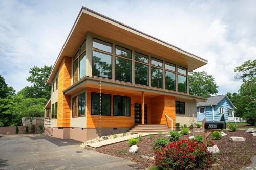 a house with a lot of windows on a street at Skyview Oasis Modern Build 1 Mile from Downtown Black Mtn! in Black Mountain