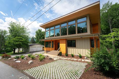 a house with a lot of windows at Skyview Oasis Modern Build 1 Mile from Downtown Black Mtn! in Black Mountain