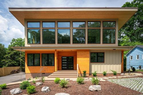 a house with large windows on top of it at Skyview Oasis Modern Build 1 Mile from Downtown Black Mtn! in Black Mountain