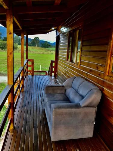 Ruang duduk di cabana e casa de campo bromélia