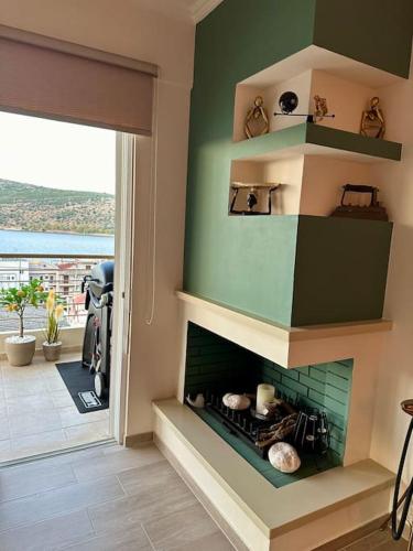 a living room with a fire place in the wall at Angel Luxury Aptm Amfilochia in Amfilochía