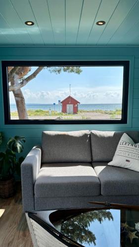 Ảnh trong thư viện ảnh của Unik beliggenhet! Lite mikrohus plassert ved populær strand ở Tønsberg