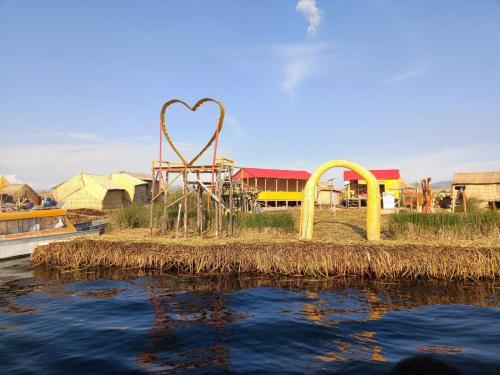 a playground with a heart sculpture in the water at Hostal Vista al Lago Titicaca Puno in Puno