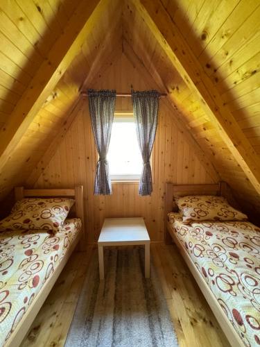 Postel nebo postele na pokoji v ubytování Mountain Houses Šarović