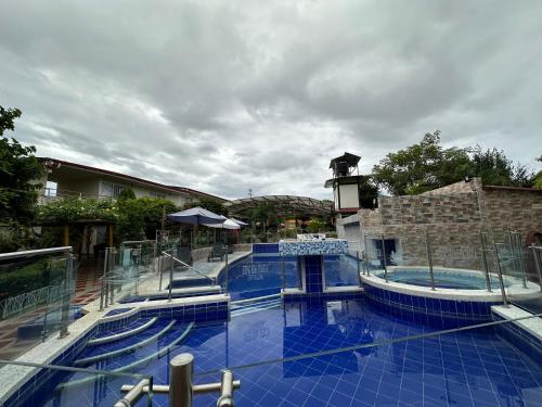 a large swimming pool with blue tiles on the ground at HV Sueño Real Tatacoa in Villavieja