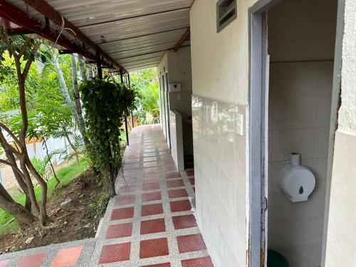 an empty hallway of a building with a porch at HV Sueño Real Tatacoa in Villavieja