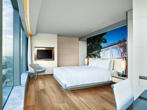 Кровать или кровати в номере EAST Beijing l 798 Art Zone l Shopping Mall l Airport l Subway