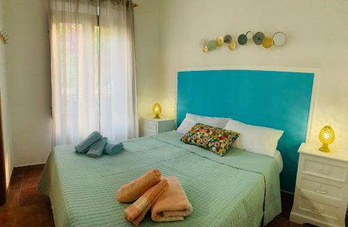 a bedroom with two beds with towels on them at Cathedral House in Palermo