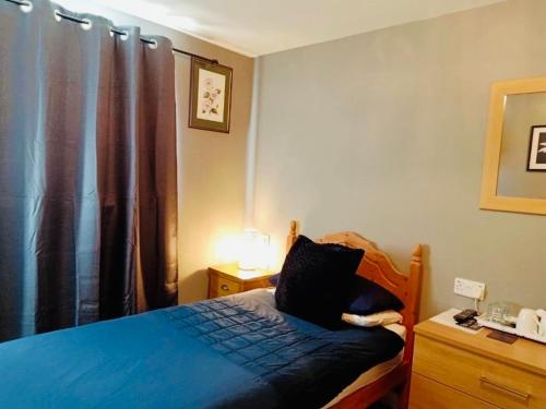 Ένα ή περισσότερα κρεβάτια σε δωμάτιο στο The Milton Accommodation