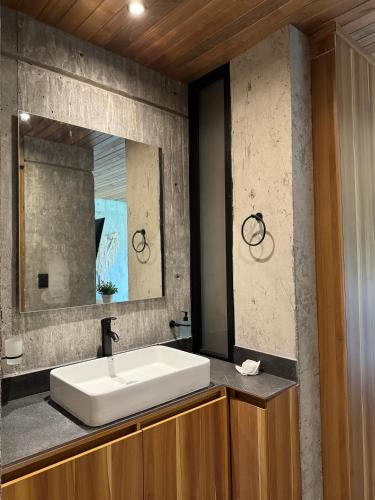 a bathroom with a sink and a mirror at Nabani Condominios T3 in Santa Cruz Huatulco