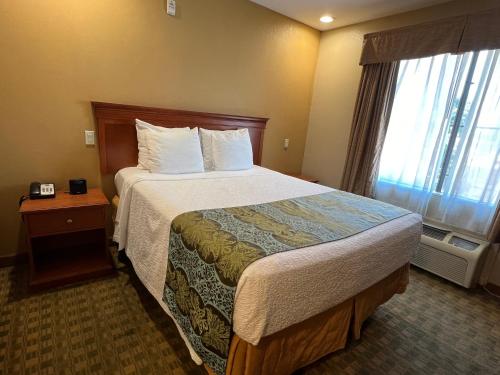 Ένα ή περισσότερα κρεβάτια σε δωμάτιο στο Pleasant Hill Inn