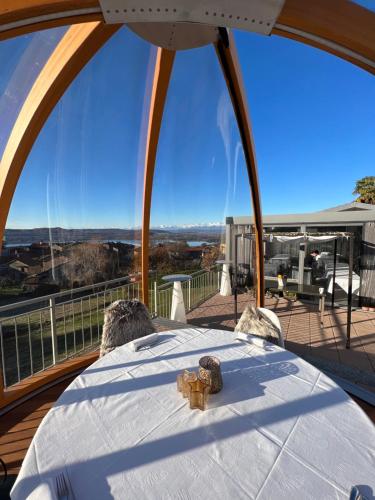 a table with a teddy bear on top of a balcony at VIVERONE LAKE ROOMS in Viverone