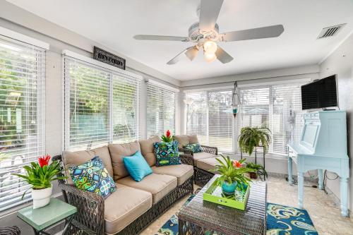 a living room with a couch and a ceiling fan at Fort Myers Bungalow - 12 Miles to the Beach! in Fort Myers