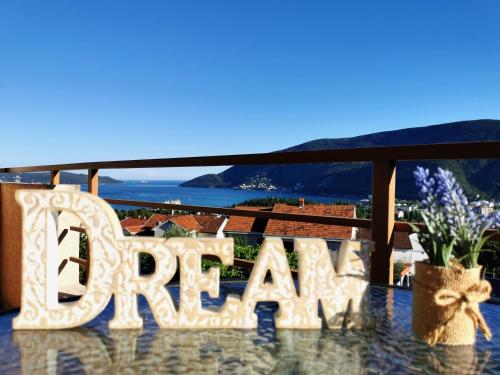 a sign that says spa on a balcony with a view of the ocean at Durakovic Apartments in Herceg-Novi