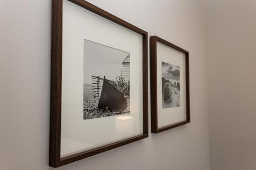 two framed pictures hanging on a wall at The Town Crier, Tenby in Tenby