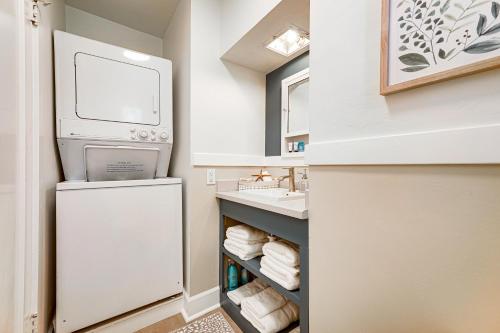 a small bathroom with a refrigerator and a sink at Helena Apartment with Patio Less Than 1 Mi to Downtown! in Helena