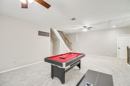 a living room with a pool table in it at Expansive Home in Humble Near Lake Houston! in Humble