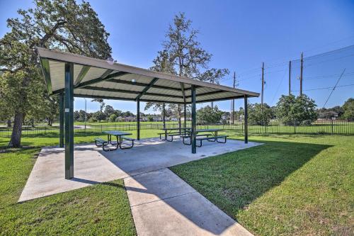 a picnic shelter with two benches in a park at Expansive Home in Humble Near Lake Houston! in Humble