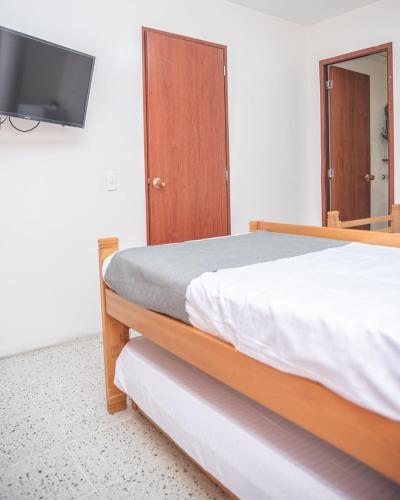 Кровать или кровати в номере Hotel Villa Park Real