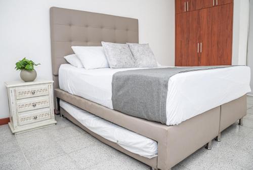 Кровать или кровати в номере Hotel Villa Park Real