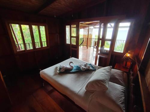 a bedroom with a bed with towels on it at Coco Bay in La Laguna