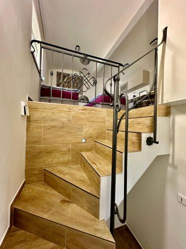 a staircase in a house with wooden stairs at Palac Anežka A1 in Brno