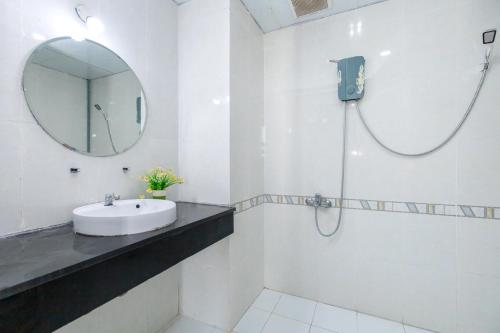 a bathroom with a sink and a mirror at Nice Apartment VT Oasky-Welcome You! in Vung Tau