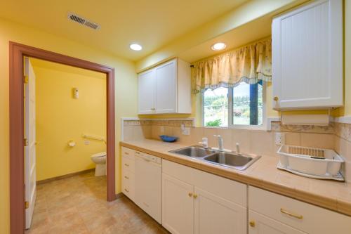 a kitchen with a sink and a toilet at Exceptional Chehalis Retreat with Scenic Views! in Chehalis