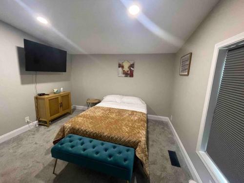 a bedroom with a bed and a tv in it at Serenity away from the big city in Amelia