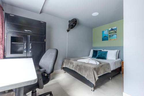 Una cama o camas en una habitación de Poblado Guest House