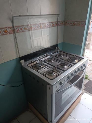 a stove in the corner of a kitchen at casa de Fidel in Tlaxcala de Xicohténcatl