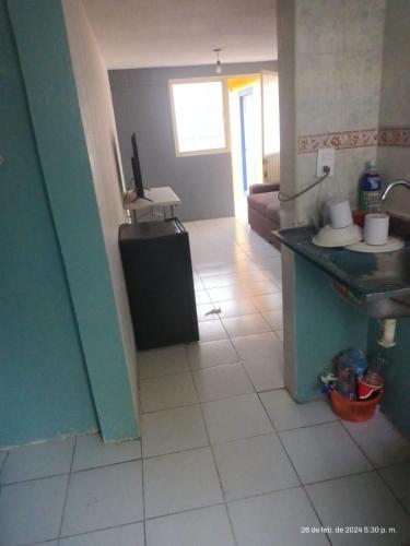 a kitchen with a sink and a tiled floor at casa de Fidel in Tlaxcala de Xicohténcatl